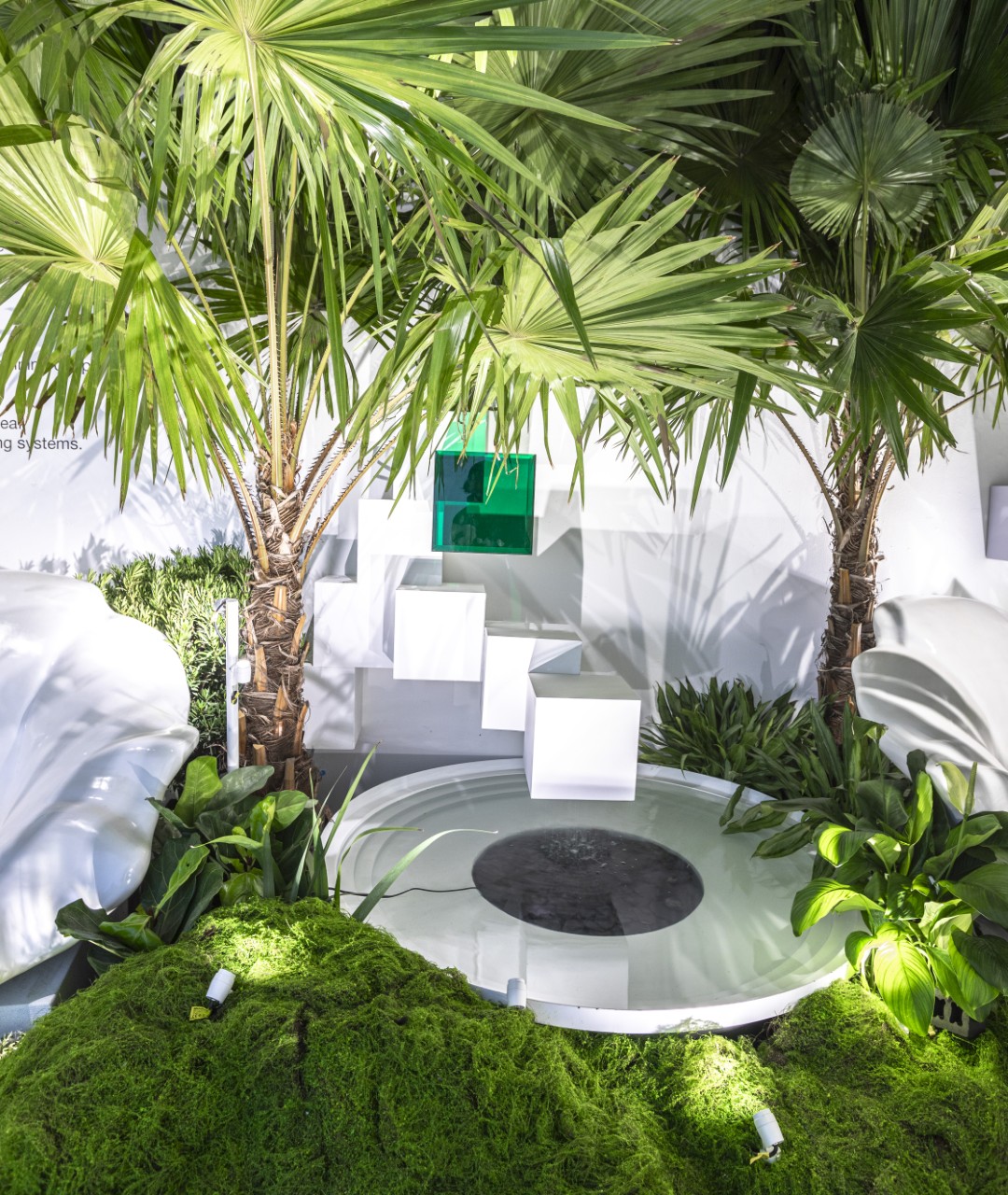 Garden exhibition lighting with palm trees and moss landscape installation
