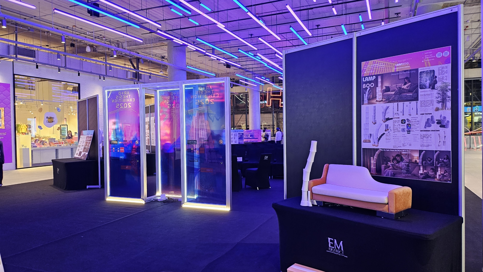 Modern design exhibition booth with neon lighting at EM District