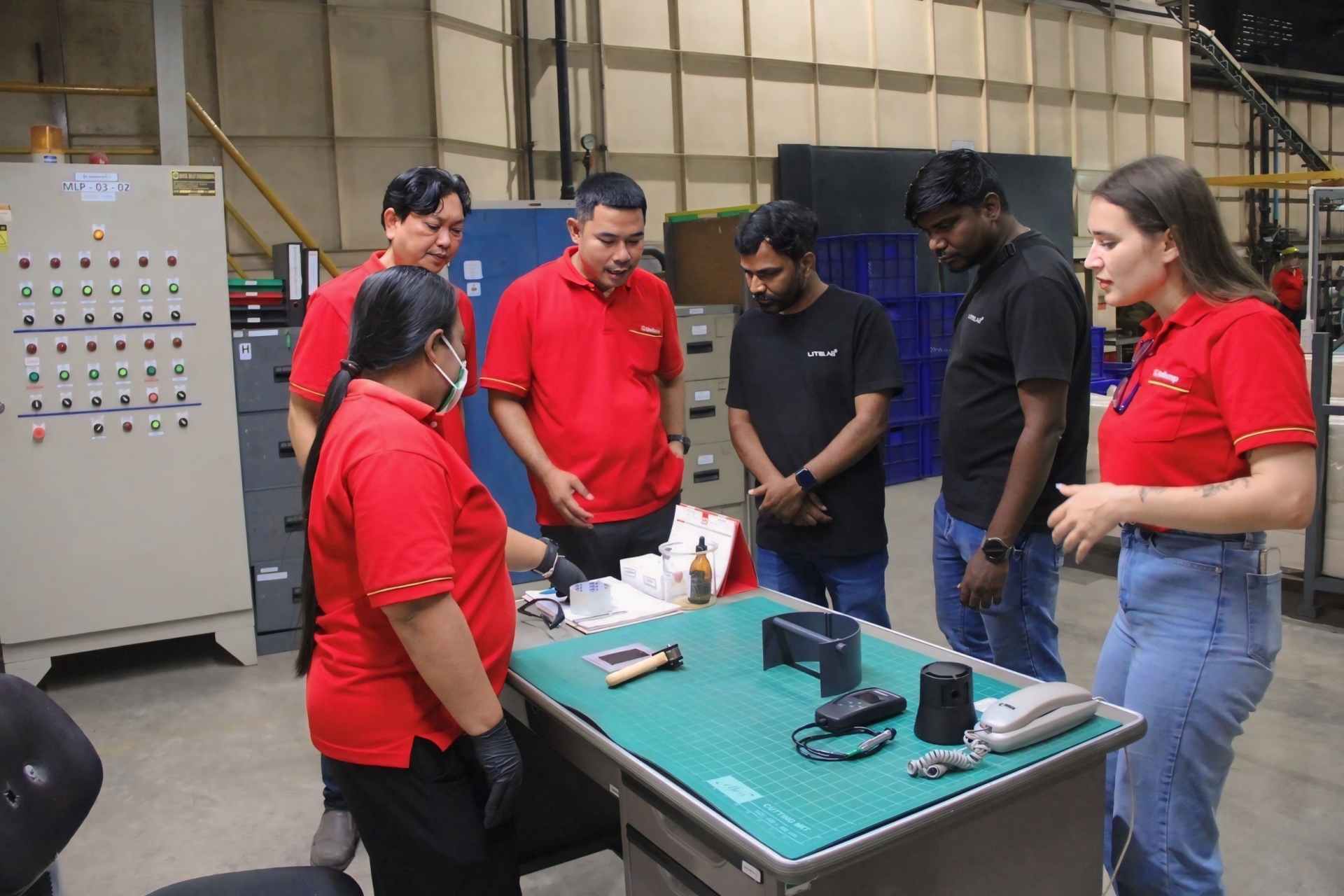 Litelab lighting designers touring Unilamp factory and observing lighting production process