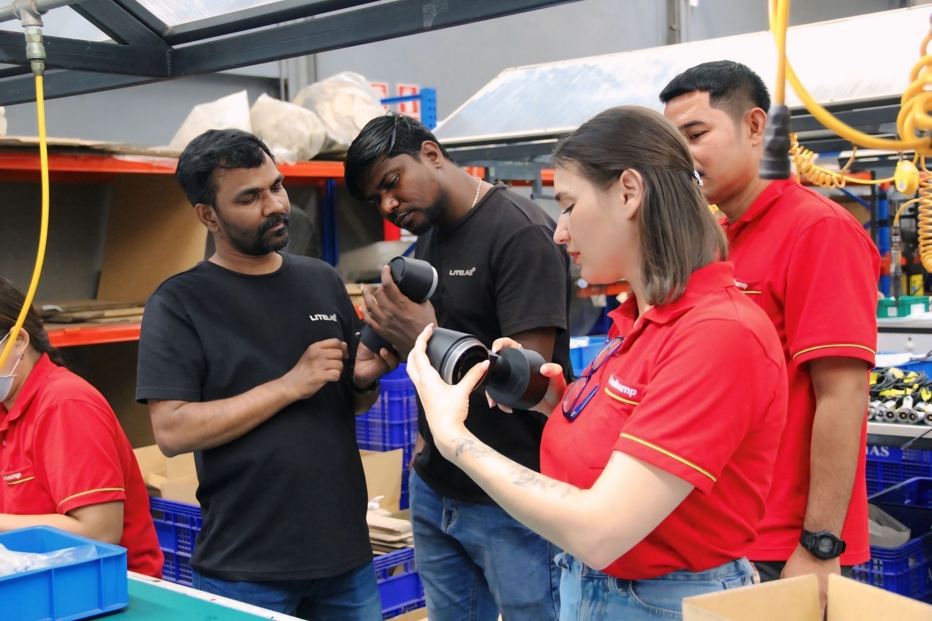 Unilamp and Litelab teams reviewing lighting components during factory visit in Thailand