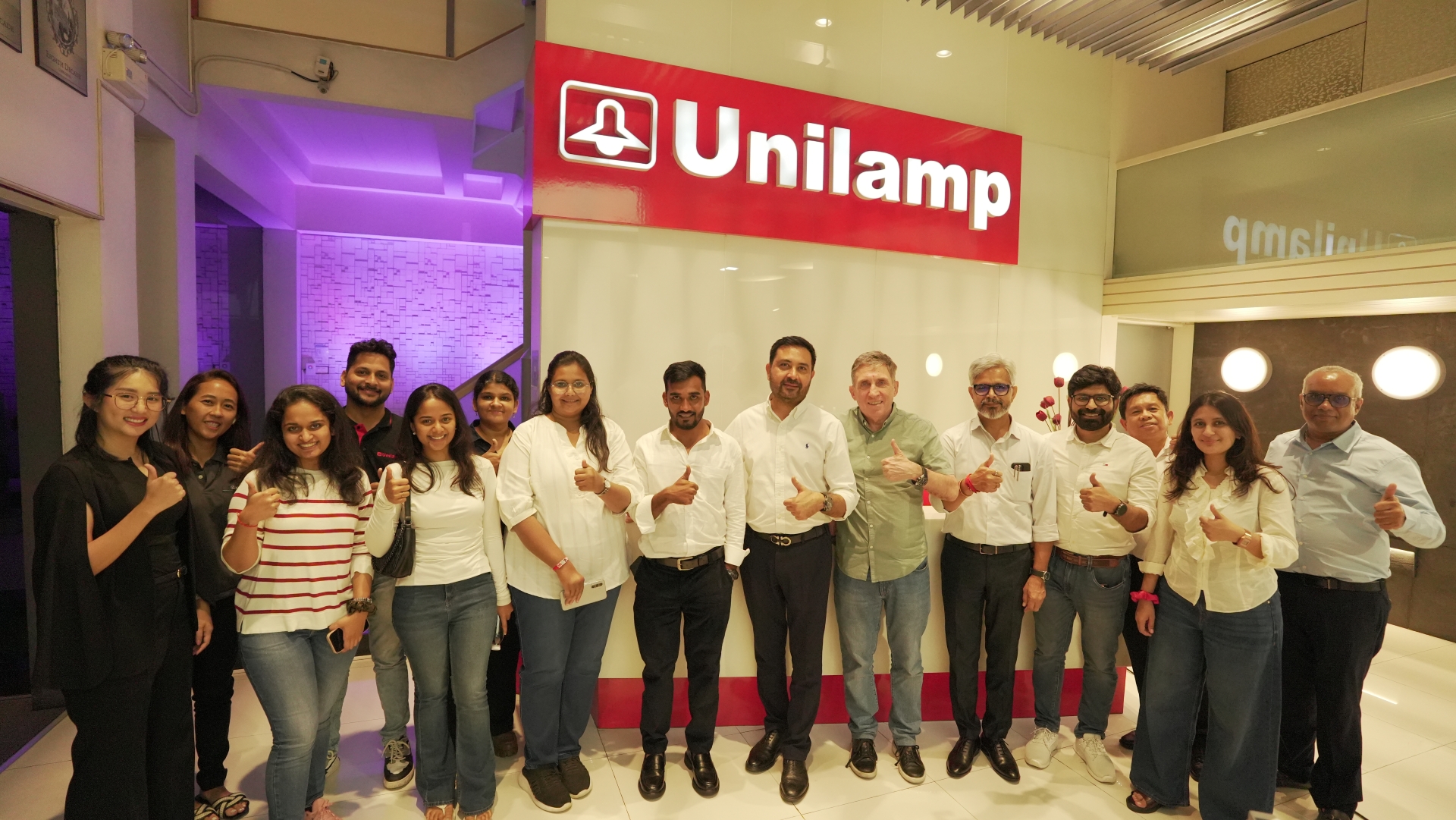 Zion Dzine team from India visiting the Unilamp showroom in Thailand for lighting collaboration.
