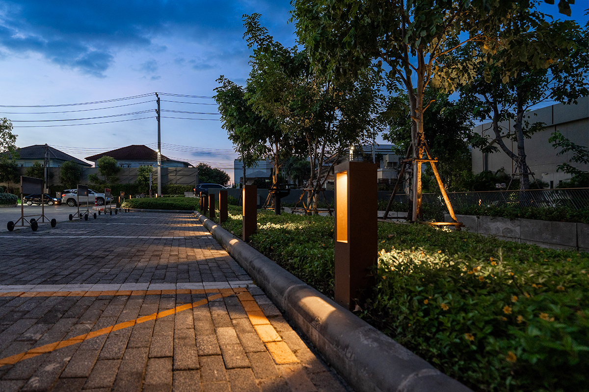 LED bollard lights along parking lot walkway at dusk