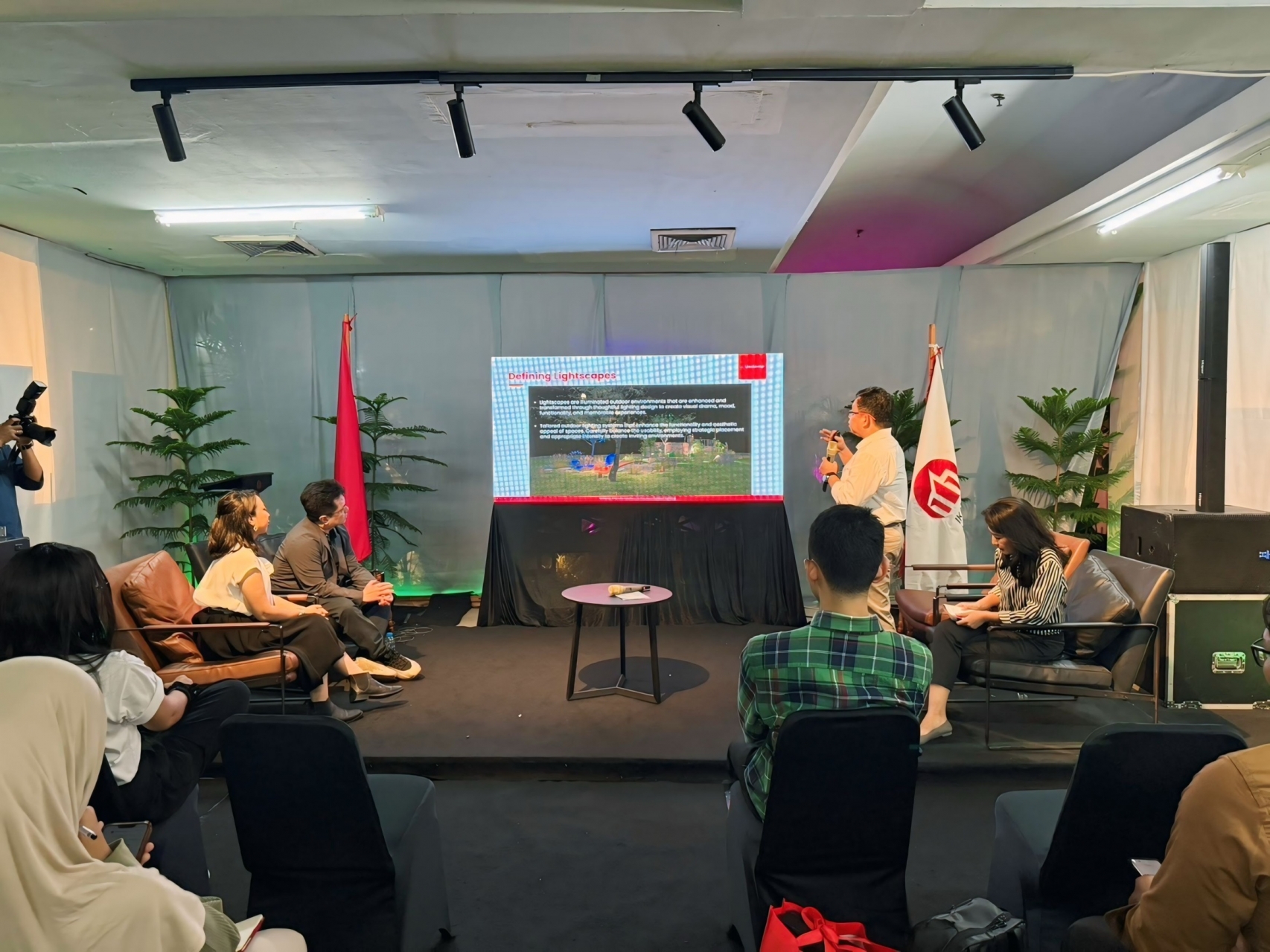 Speaker presenting lighting design topic at Jakarta Architecture Festival 2025 seminar.