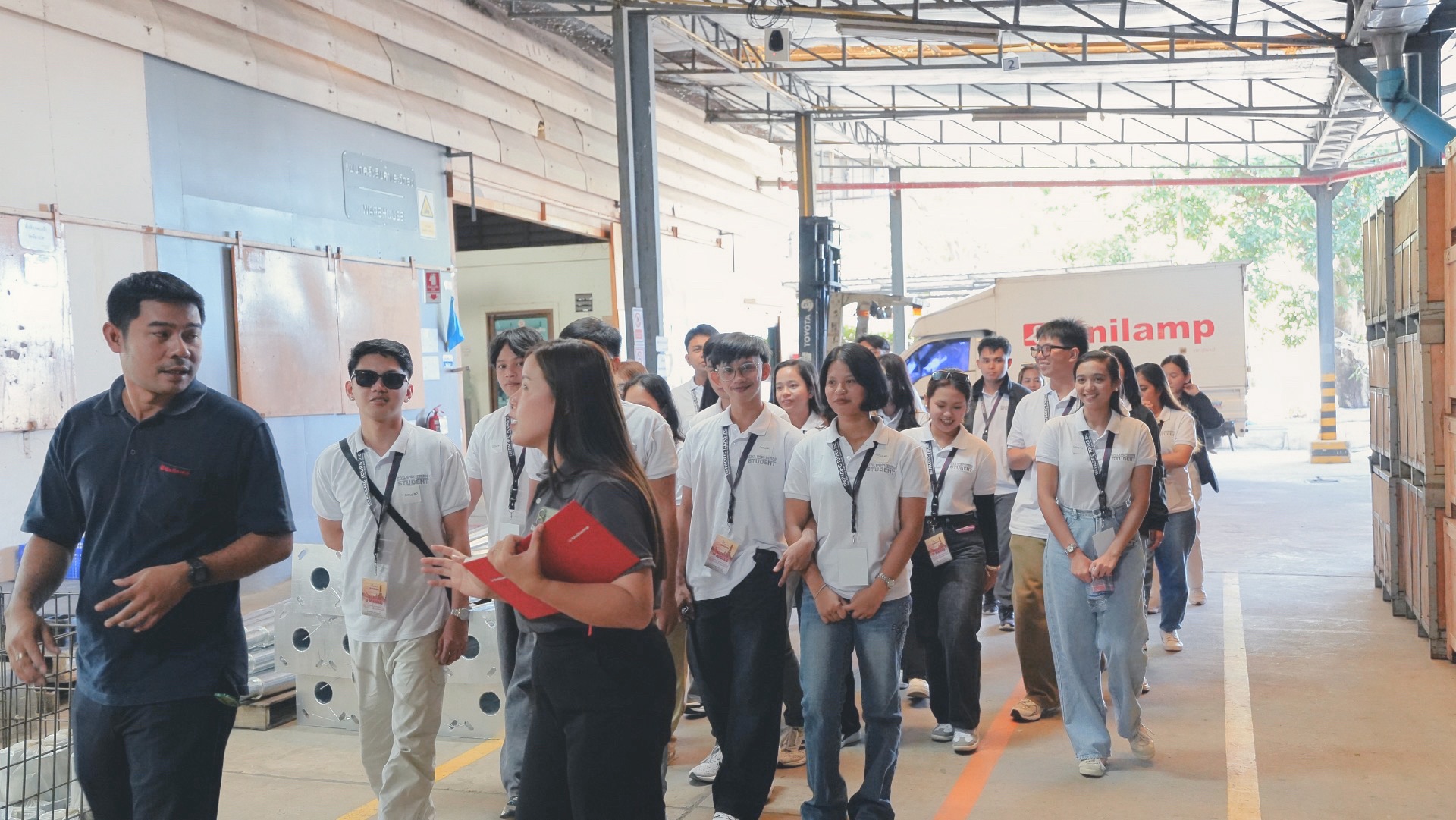 University of Mindanao engineering students touring the production area during their educational visit to the Unilamp factory.