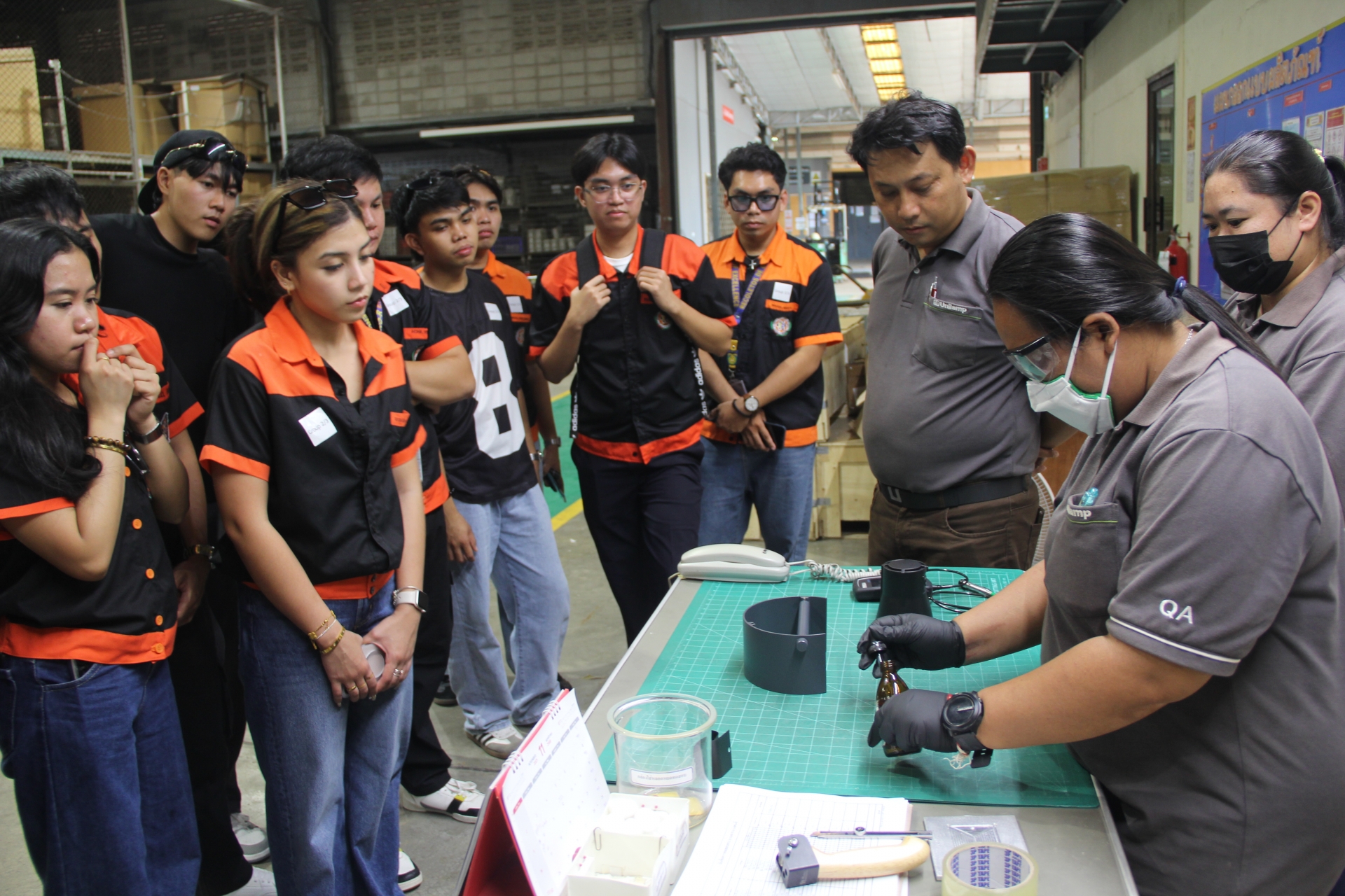 UNOR engineering students observing quality testing at Unilamp factory