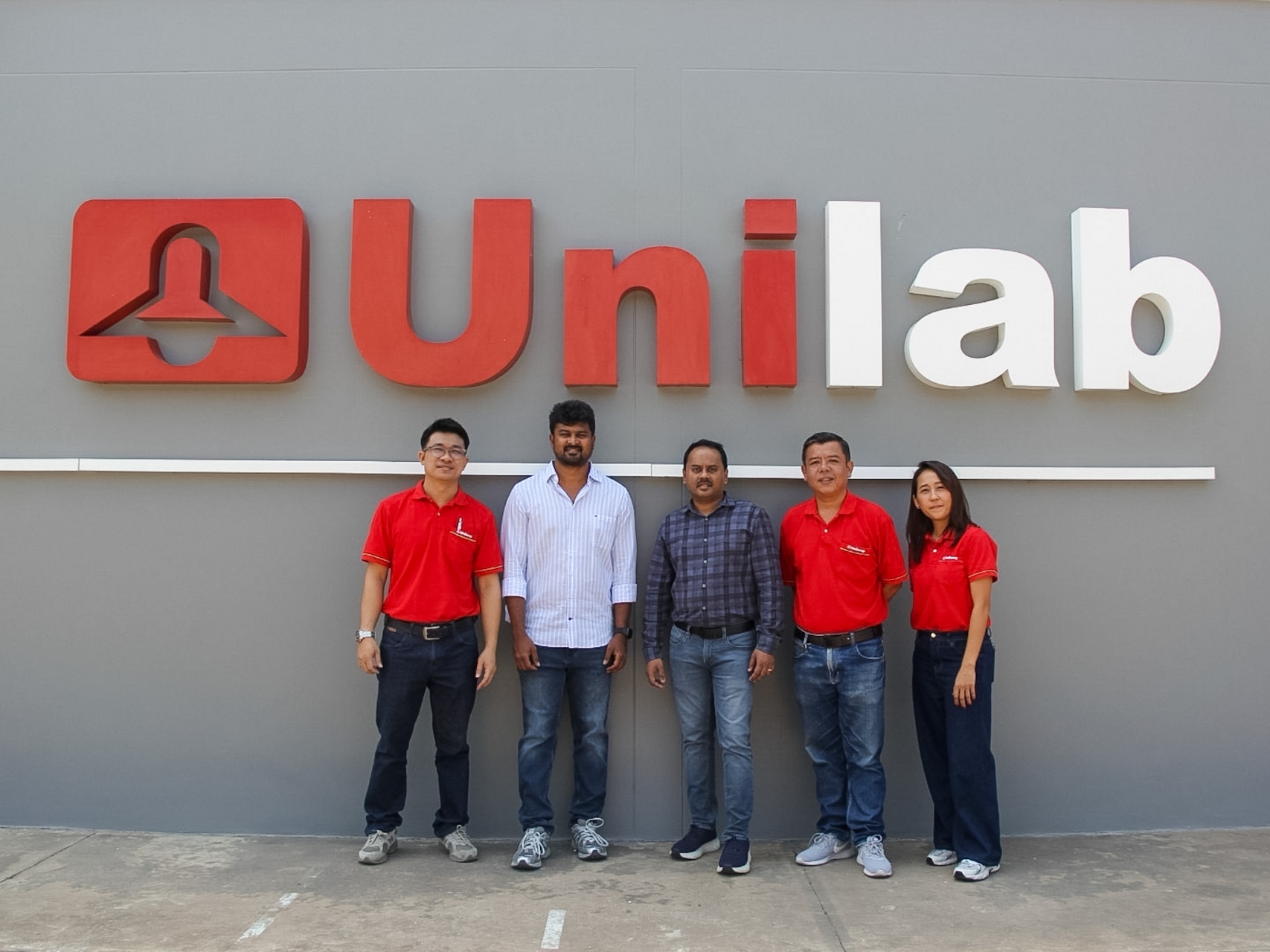 Polaris Lighting team visiting Unilamp factory entrance Thailand