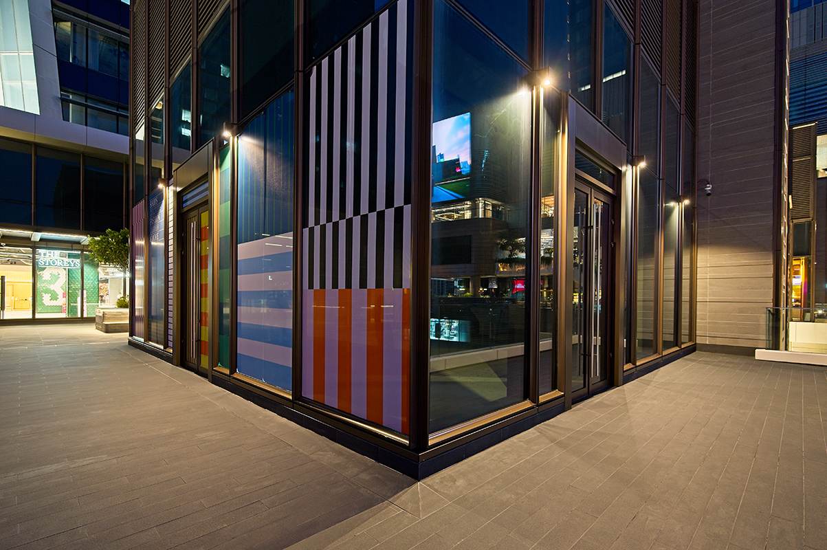 MIRA wall luminaires lighting the exterior corner of One Bangkok building.